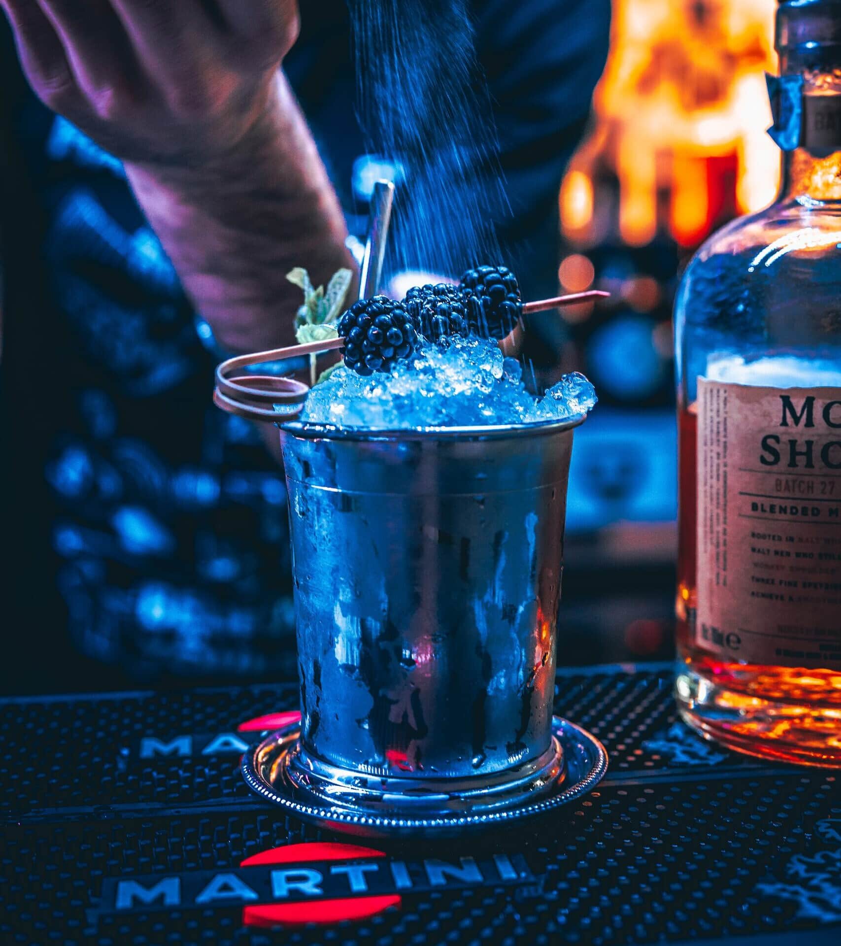 blue and black glass bottle