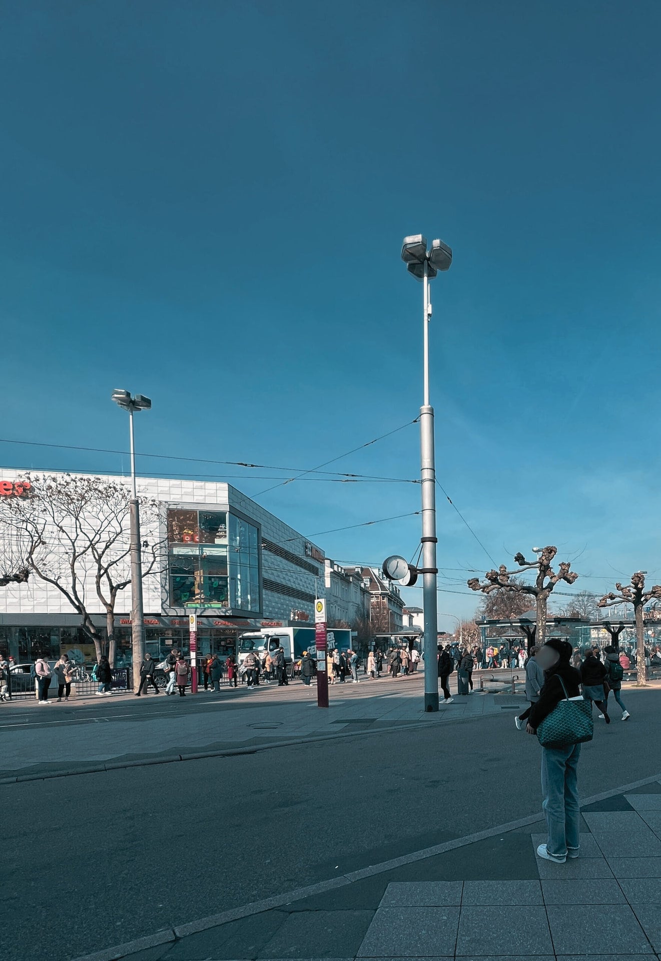 Picture of Bismarckplatz with train station and Müller from a different angle